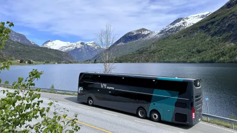 VY bus driving through the fjord landscape of Norway