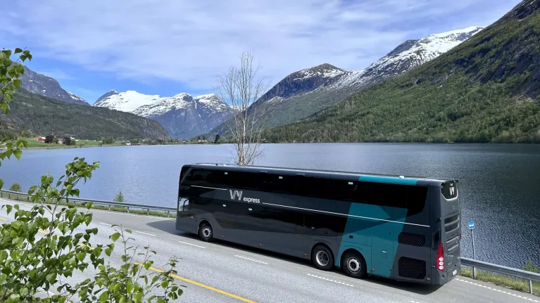 VY bus driving through the fjord landscape of Norway