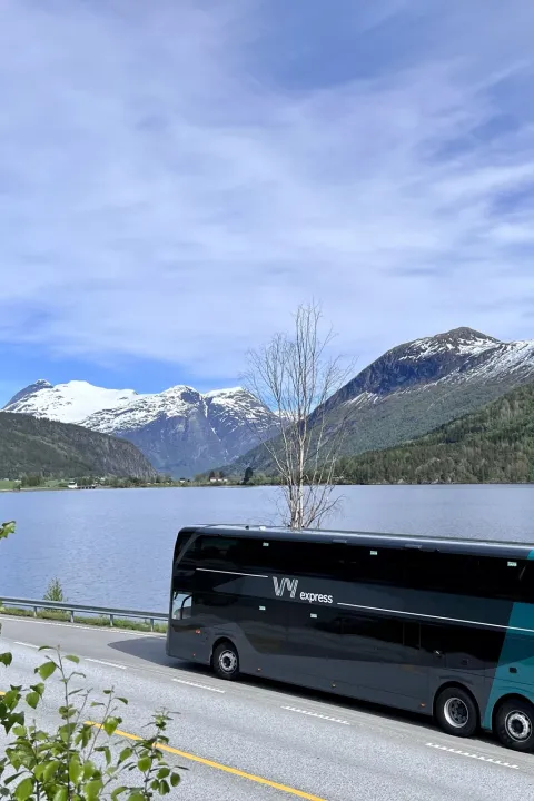 VY bus driving through the fjord landscape of Norway