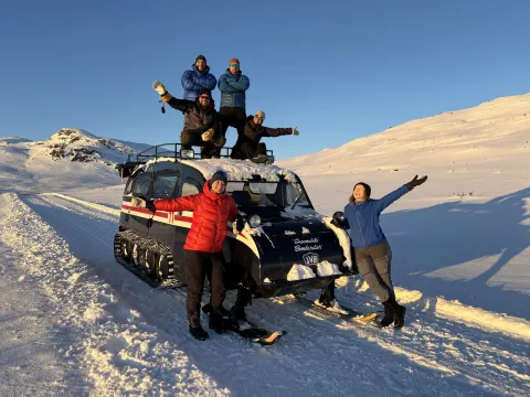 JVB Team in winter with a nostalgic snowcoach